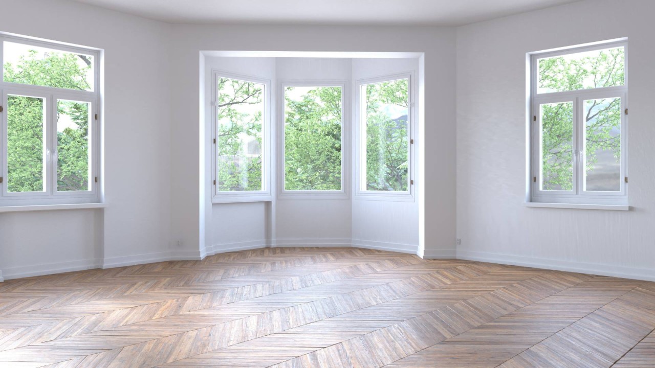  A room in a new home with a bay window and parquet floors at The Shady Lady Interiors near Oklahoma City, OK